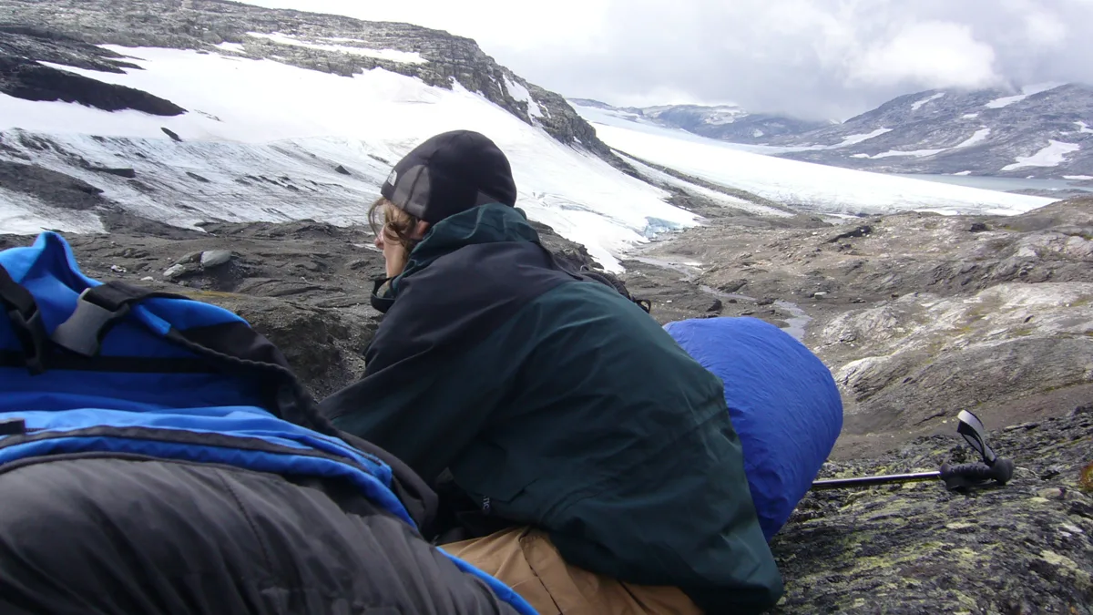 Expansive white glacier field beneath a cold northern sky